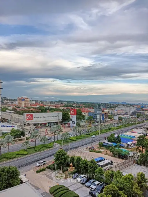 Stunning cityscape view from high-rise building showcasing vibrant urban life and scenic horizon.