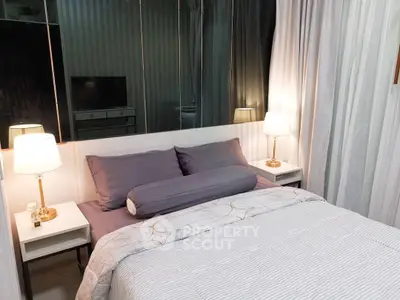 Cozy bedroom with elegant decor and soft lighting, featuring a comfortable bed and stylish bedside lamps.
