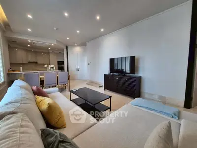 Spacious modern living room with open kitchen and elegant decor