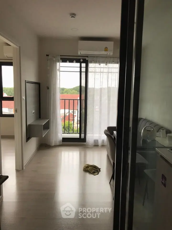 Modern apartment interior with balcony view and natural light