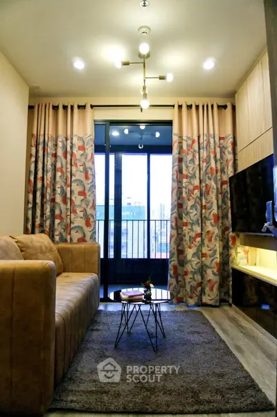 Stylish living room with modern decor and balcony view