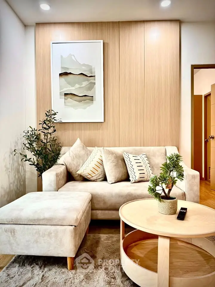 Stylish modern living room with cozy beige sofa and chic decor