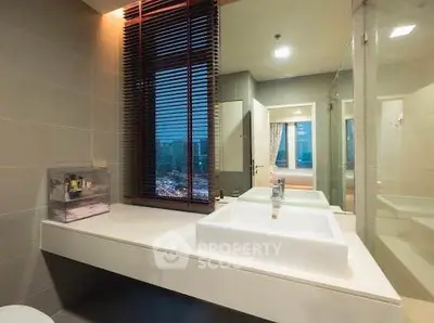 Modern bathroom with dual sinks and city view window, featuring sleek design and ambient lighting.
