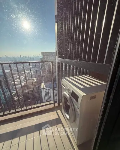 High-rise balcony with washing machine and stunning city view
