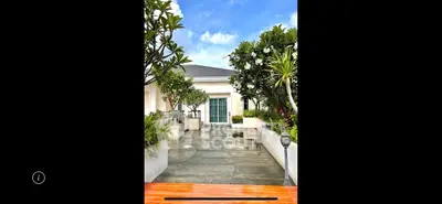 Luxurious garden entrance with lush greenery and modern design