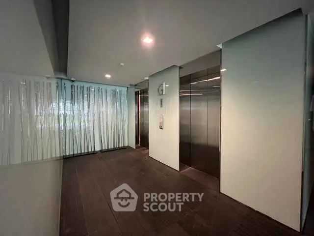 Modern building elevator lobby with sleek design and ambient lighting