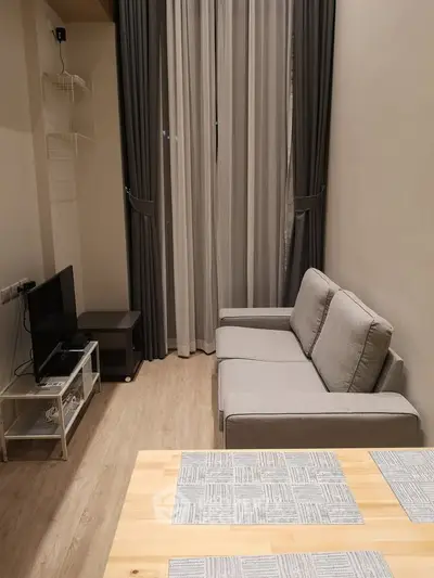 Cozy modern living room with elegant curtains and comfortable seating