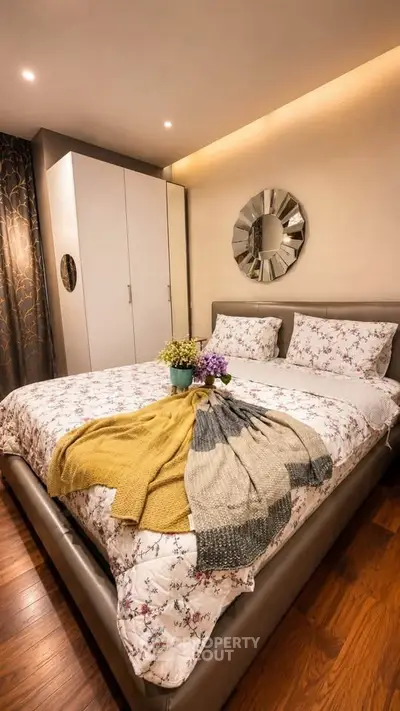 Cozy bedroom with elegant decor and plush bedding in modern apartment