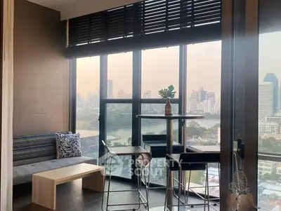Modern high-rise apartment with stunning city view and stylish interior design.