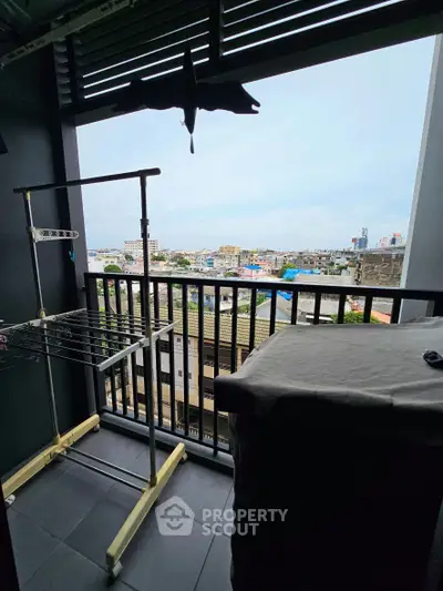 Charming balcony with city view, perfect for relaxation and enjoying the skyline.