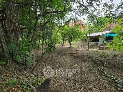 Charming rustic property with lush greenery and cozy cottage, perfect for nature lovers.