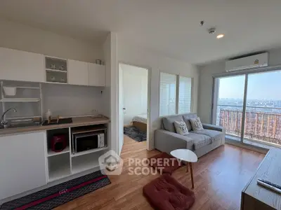 Modern open-plan living room with city view and cozy furnishings