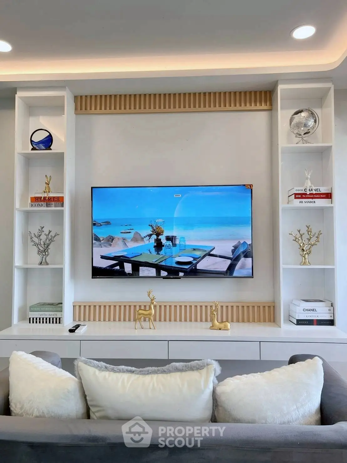 Stylish living room with modern TV setup and elegant decor accents.