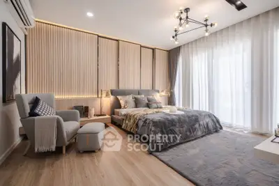 Luxurious modern bedroom with stylish decor and large windows
