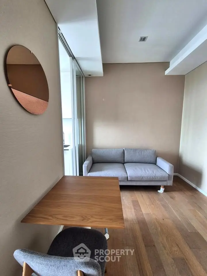 Modern living room with stylish sofa and wooden table, perfect for cozy relaxation.