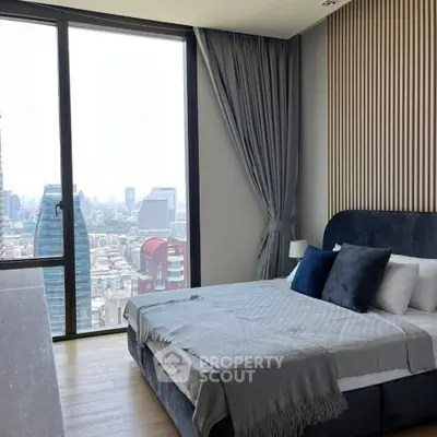 Luxurious bedroom with stunning city view from floor-to-ceiling window, elegant decor and cozy bedding.