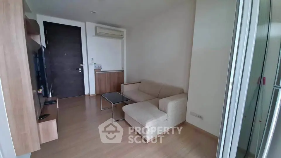 Modern living room with sleek design and cozy sofa in a stylish apartment.