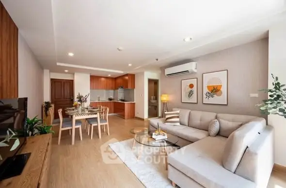 Spacious modern living room with open kitchen and stylish decor