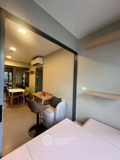 Spacious living room with modern furniture and open layout, perfect for entertaining guests.