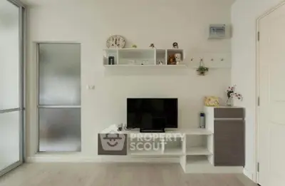 Modern living room with sleek TV unit and minimalist decor
