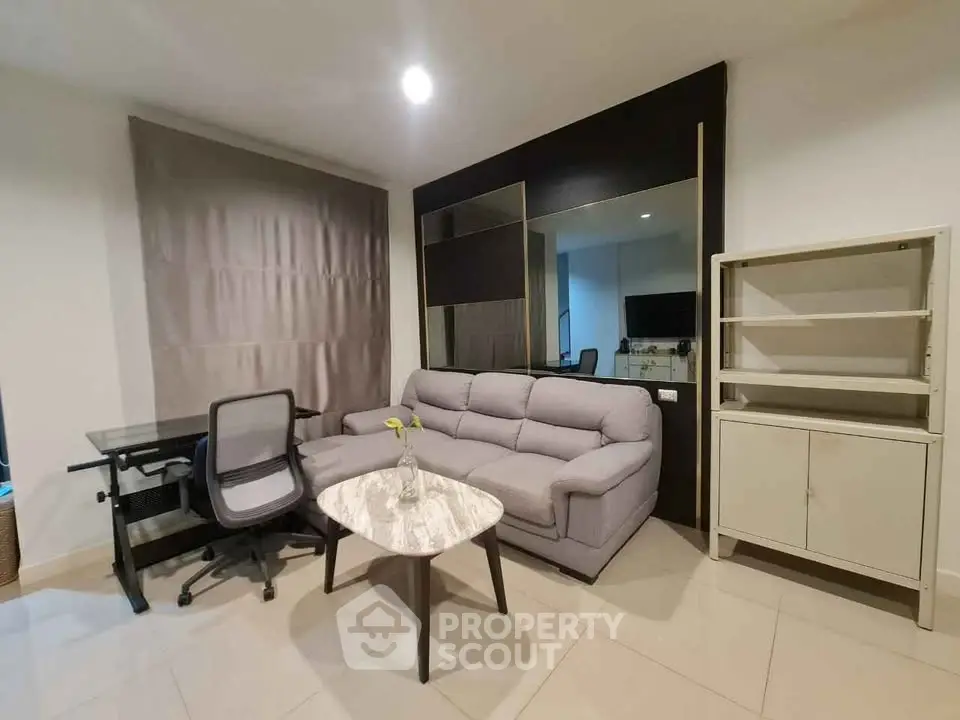 Modern living room with stylish furniture and sleek design, perfect for urban living.