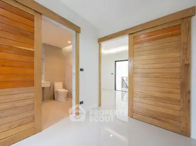 Modern interior with wooden sliding doors and sleek bathroom design