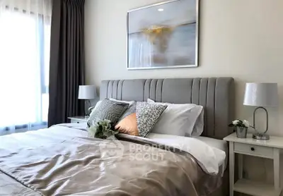 Elegant bedroom with plush bedding and stylish decor in modern apartment
