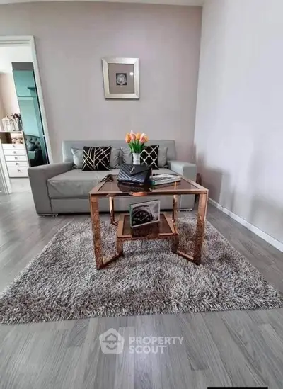 Stylish living room with modern decor and cozy seating area.