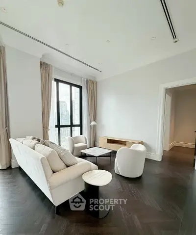Luxurious modern living room with elegant furniture and city view, perfect for urban living.