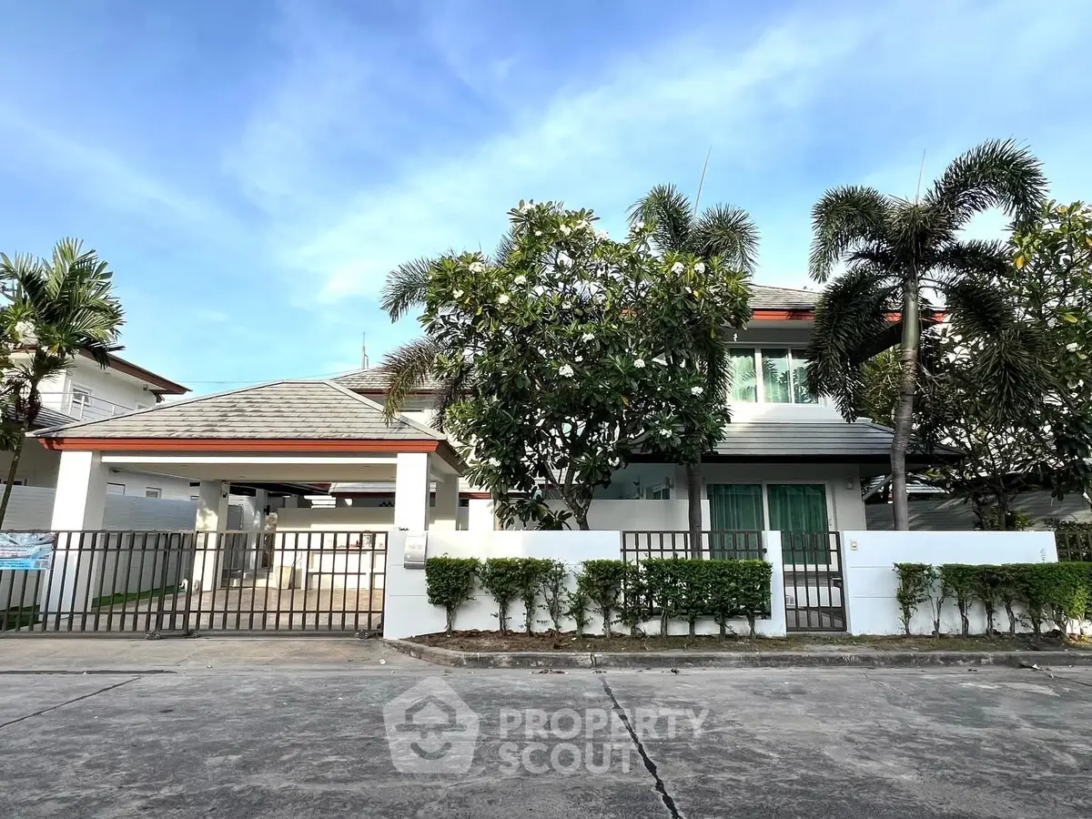 Charming suburban house with lush greenery and modern design.