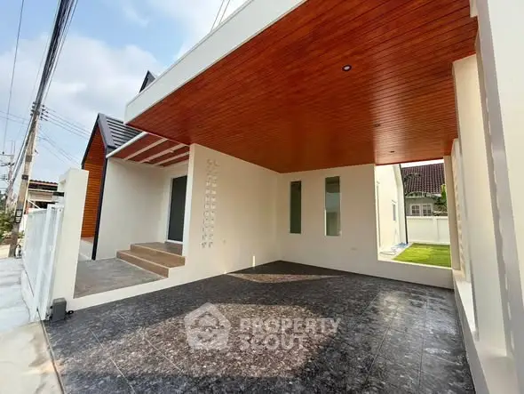 Modern home exterior with sleek design and spacious driveway