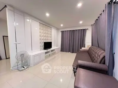 Spacious living room with modern decor and comfortable seating