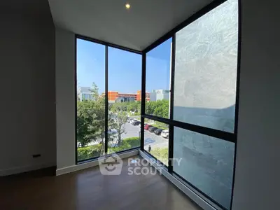 Spacious corner unit with floor-to-ceiling windows offering a stunning view of the cityscape.