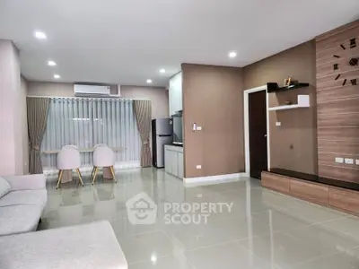 Modern living room with sleek design, open layout, and stylish furniture.