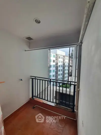 Compact balcony with city view in modern apartment building