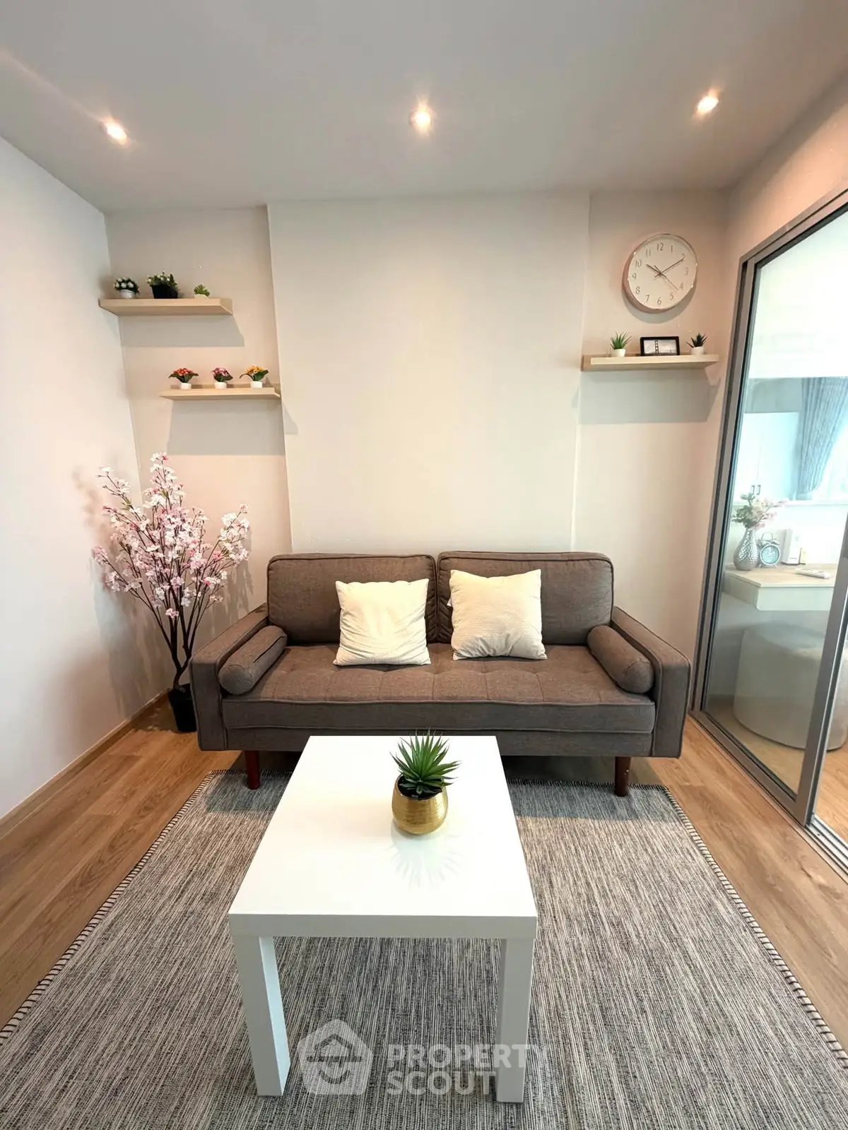 Chic modern living room with cozy sofa, stylish decor, and natural light for a welcoming ambiance.