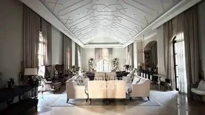 Luxurious and spacious living room with elegant high ceiling and sophisticated decor
