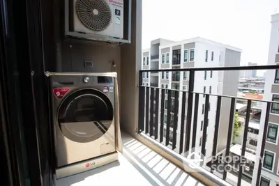 Modern balcony with washing machine and city view in urban apartment