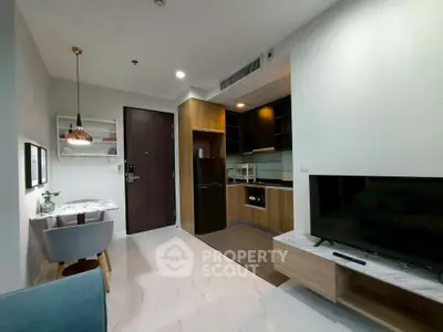 Modern open-plan living room with sleek kitchen and stylish decor