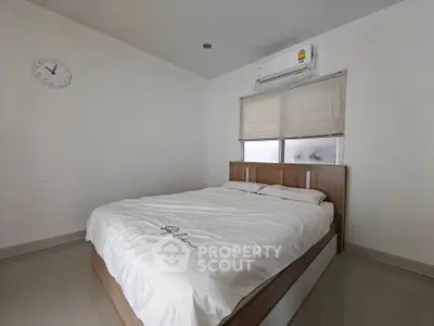Modern minimalist bedroom with air conditioning and sleek design