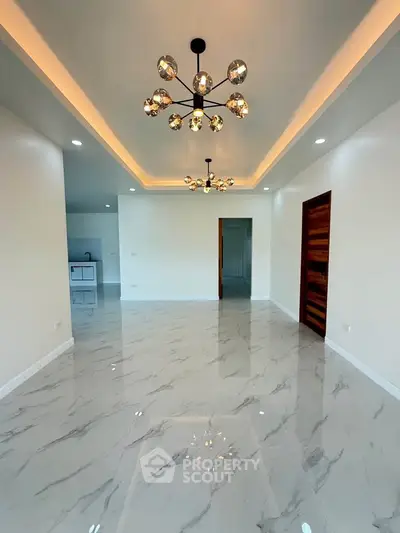 Modern living room with elegant lighting and marble flooring