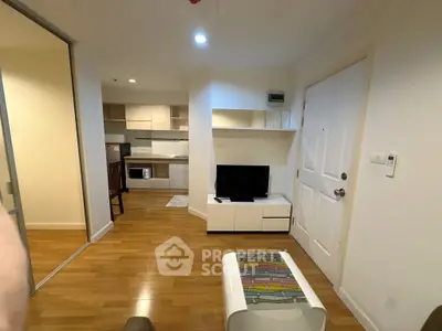 Modern living room with open kitchen and stylish wooden flooring