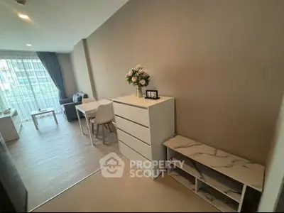 Modern living room with stylish furniture and natural light in a contemporary apartment.