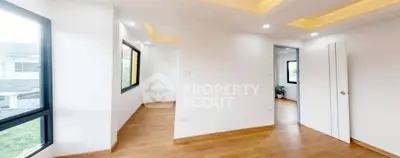 Spacious modern interior with wooden flooring and recessed lighting