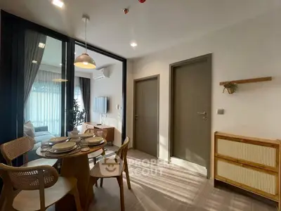 Modern dining area with natural light and stylish decor in a contemporary apartment.