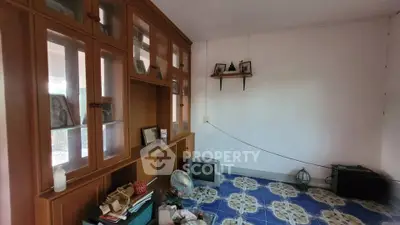 Spacious room with vintage wooden cabinets and decorative tiled flooring