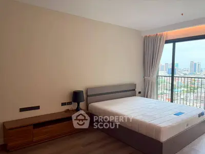 Modern bedroom with city view and stylish furniture in high-rise apartment