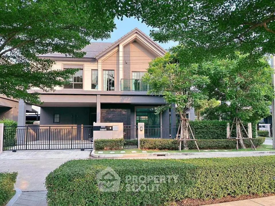 Charming modern house with lush greenery and spacious front yard