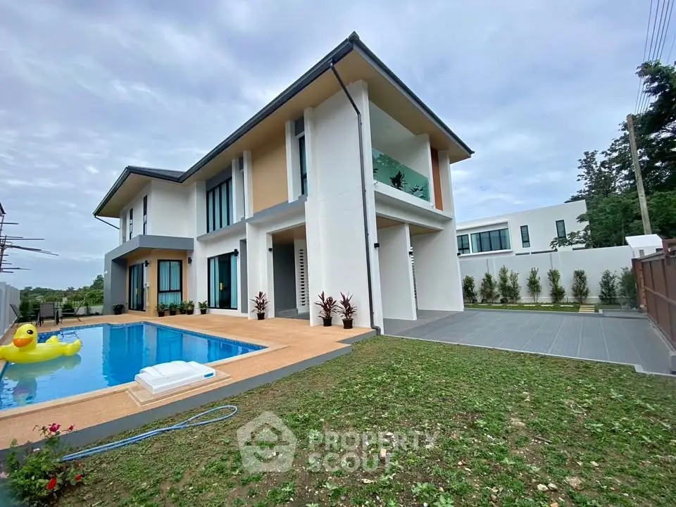 Luxurious modern villa with private pool and spacious garden area, perfect for family living.