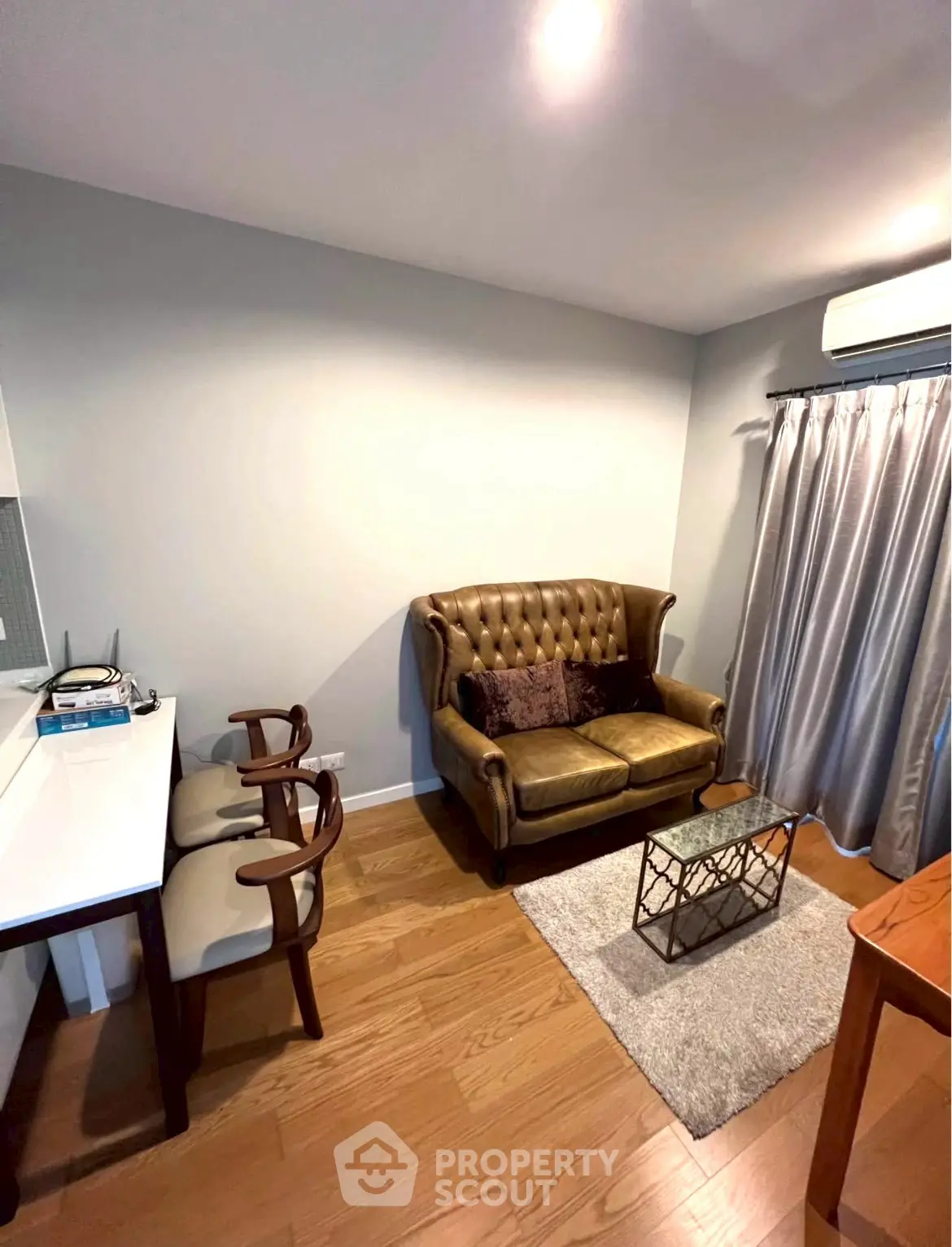 Cozy living room with elegant sofa and modern decor in a stylish apartment.